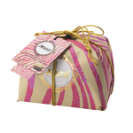 Gift box with pink and gold striped design and 'Muzzi' branding on a white background