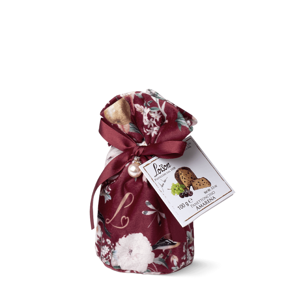 Floral-patterned bag with a bow and a tag on a white background