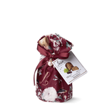 Floral-patterned bag with a bow and a tag on a white background