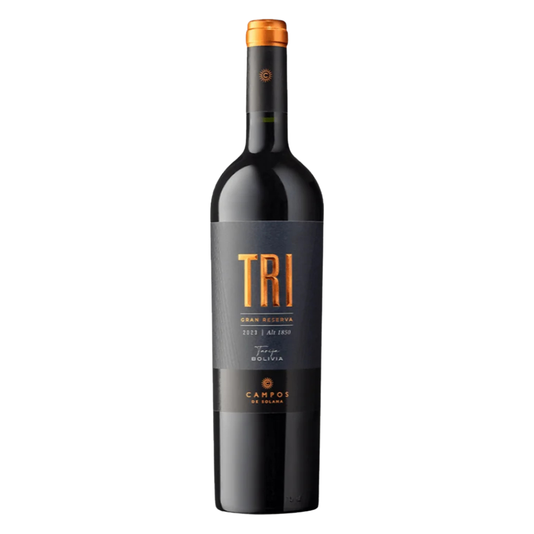 A bottle of Campos de Solana Tri Varietal Gran Reserva Tinto with a dark glass body and a black label featuring bold gold “TRI” lettering, set against a black background.