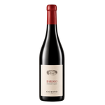 Red wine bottle with a white label on a white background