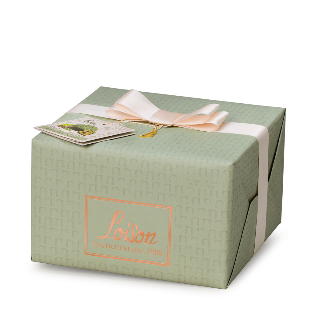 Green gift box with a pink ribbon and card on a white background