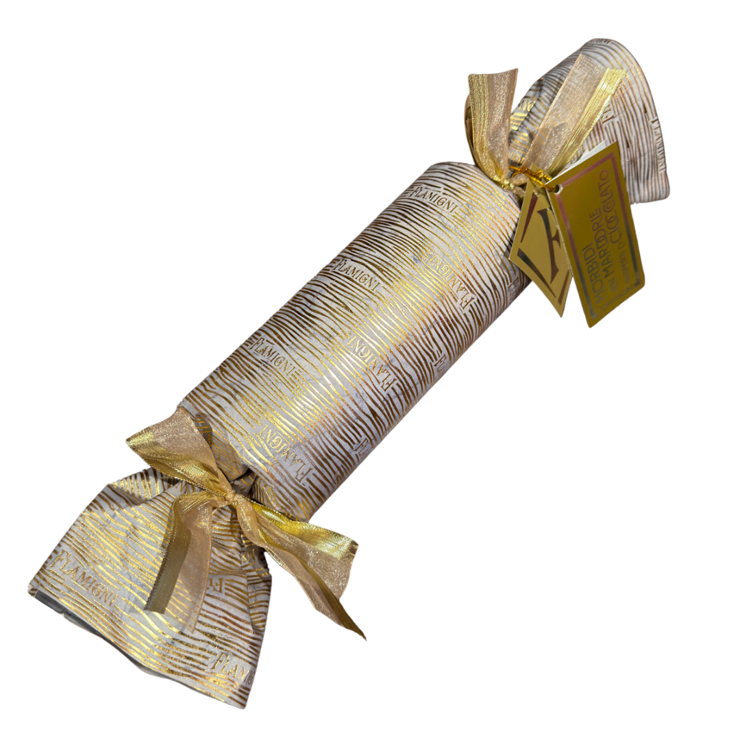 Decorative cracker with gold ribbon and tag on a white background